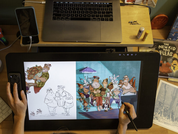 Person using a tablet to draw digital characters