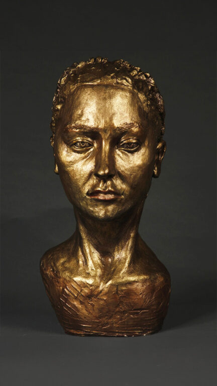 Bronze sculpture of a woman's face