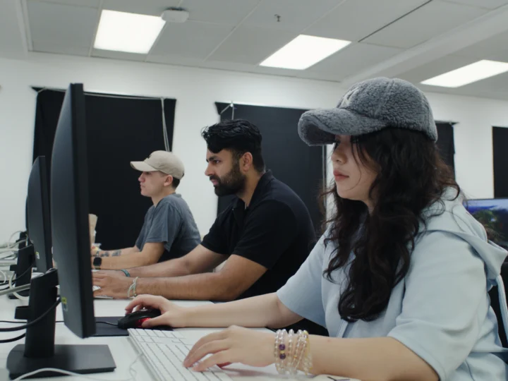 Students working on computers in the Editing Bay